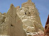 Tibet Guge 08 Tsaparang 06 Looking Up To Siege Tower From just outside the Yamantaka Temple I stared up at a strange windowless structure near the top of the slope. This is thought to be the base of a huge siege tower built by the invading Muslim army who destroyed the kingdom.